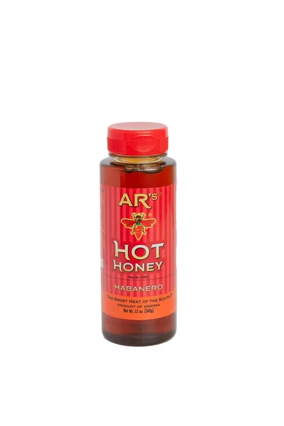 A bottle of AR's Hot Honey Habanero honey with a red cap and red label, set against a plain light gray background.