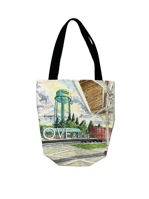 Tote bag with a scenic design and 'Love & Hope' text on white background
