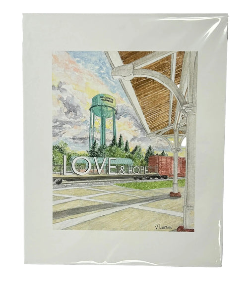 Artistic depiction of a water tower with 'Love & Hope' sign, framed on a white surface.