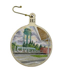  Round wooden ornament with water tower and 'LOVE & HOPE' text on a white surface