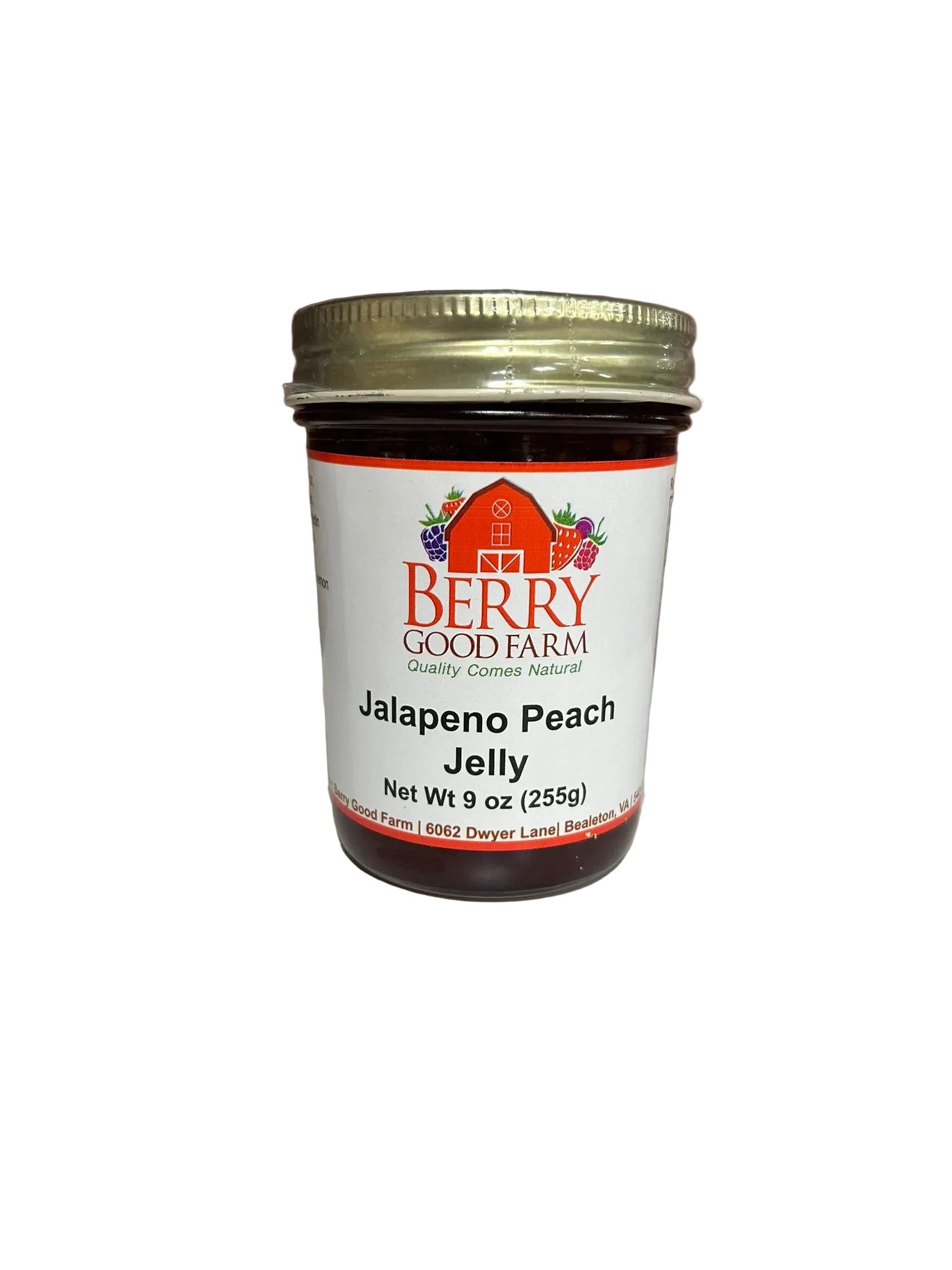 Jar of Jalapeno Peach Jelly from Berry Good Farm on a white surface 