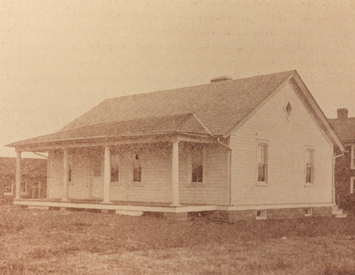 Black and white photograph of the Manassas Industrial School model cottage.
